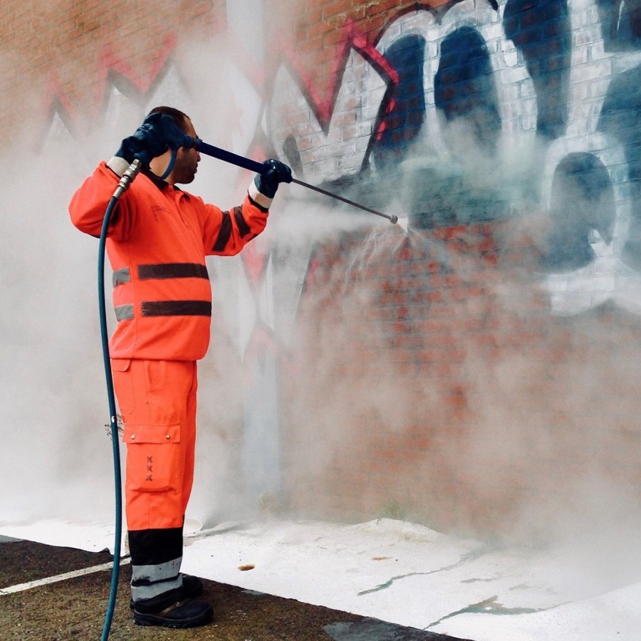 Graffiti removal on a commercial building